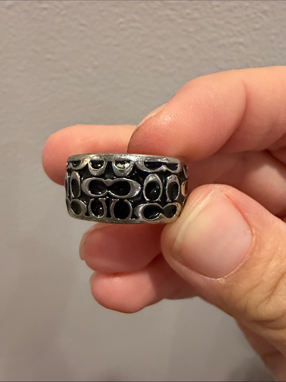 Coach Black and Silver Openwork Signature Band Ring